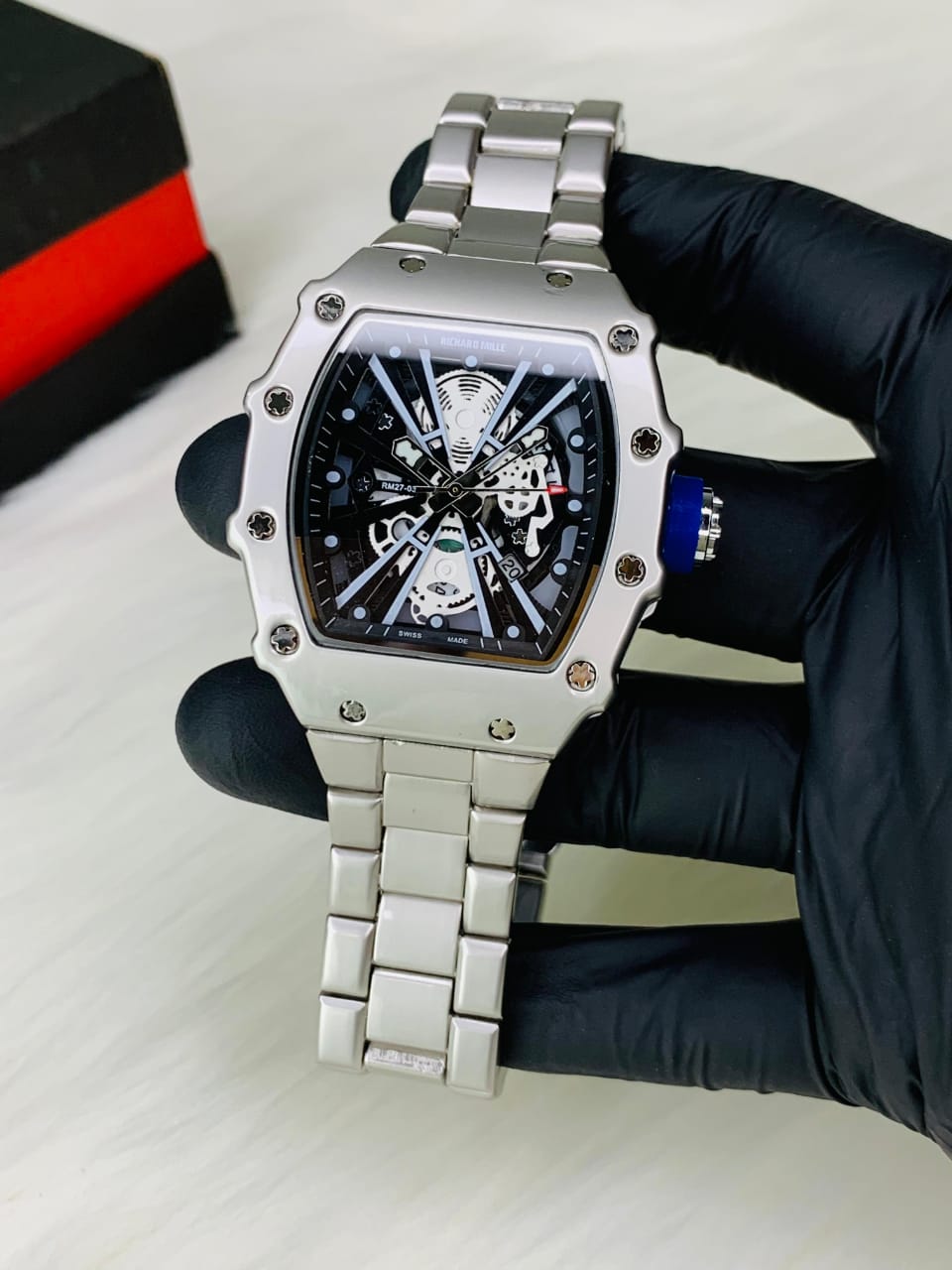 Carbon fiber watch back view with green crown