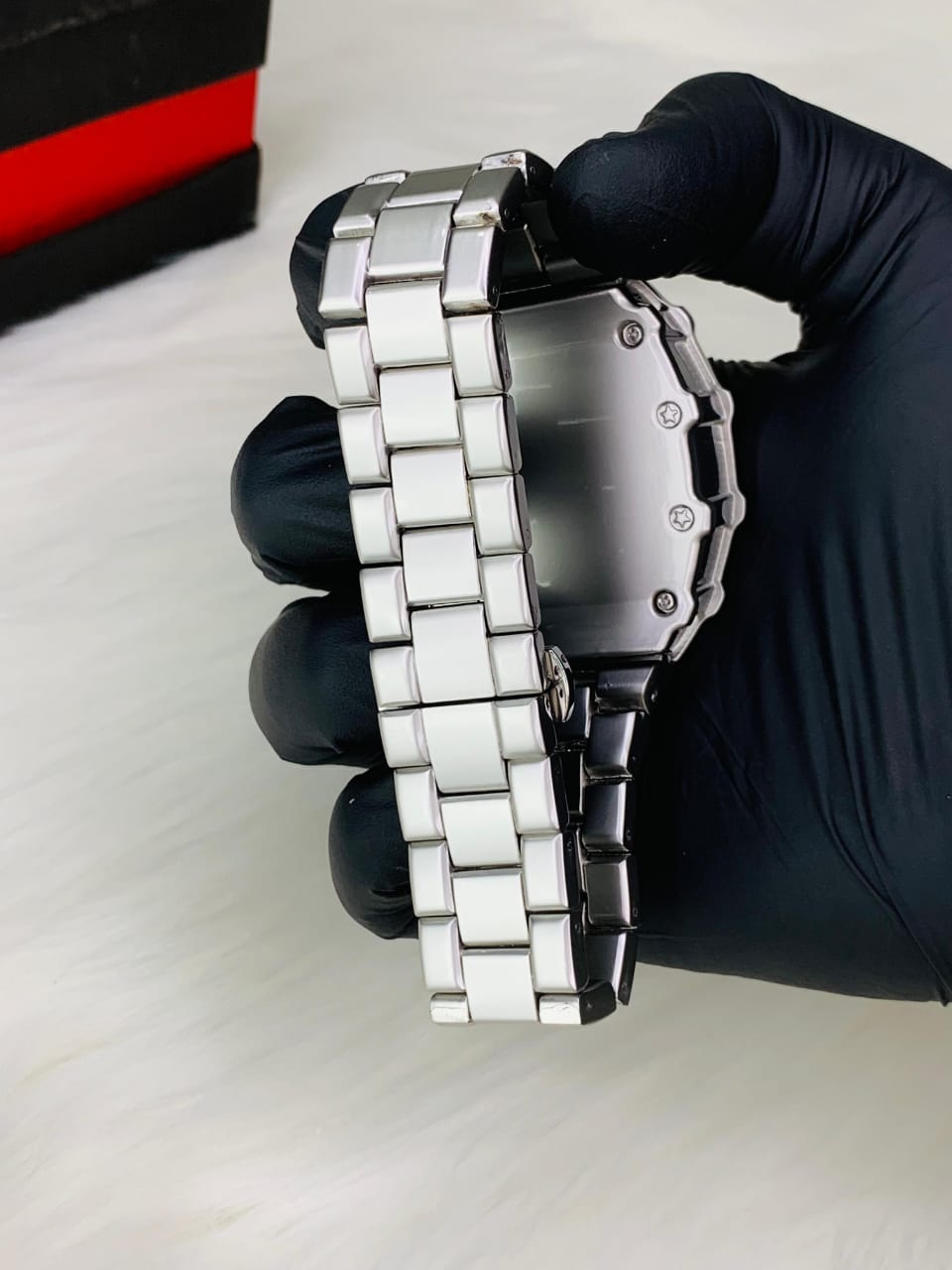 Carbon fiber watch side view with red bezel